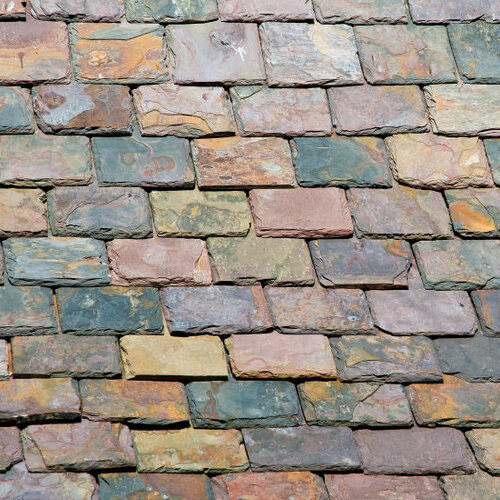 Close-up of multi-colored slate roof shingles.