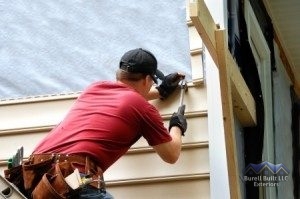 Contractor Installing Siding